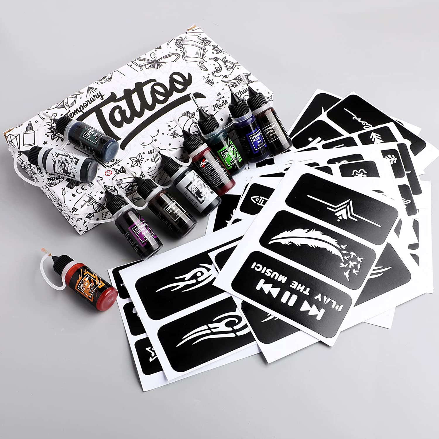 Kit de tatuaje temporare cu 10 sticle de cerneala diferite de 15 ml si 84 sabloane diferite, rezistente la apa, usor de utilizat